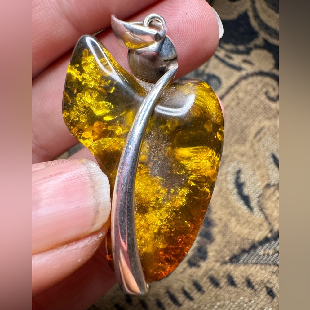 Amber and sterling silver pendant.